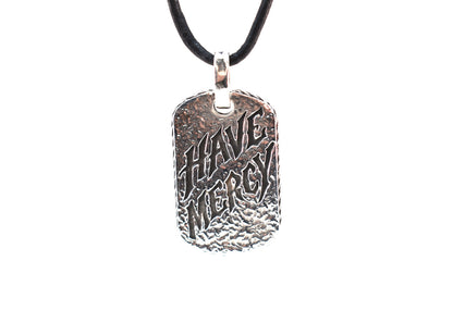 Have Mercy .925 sterling silver dog tag pendant by Billy F Gibbons on black leather cord, front view